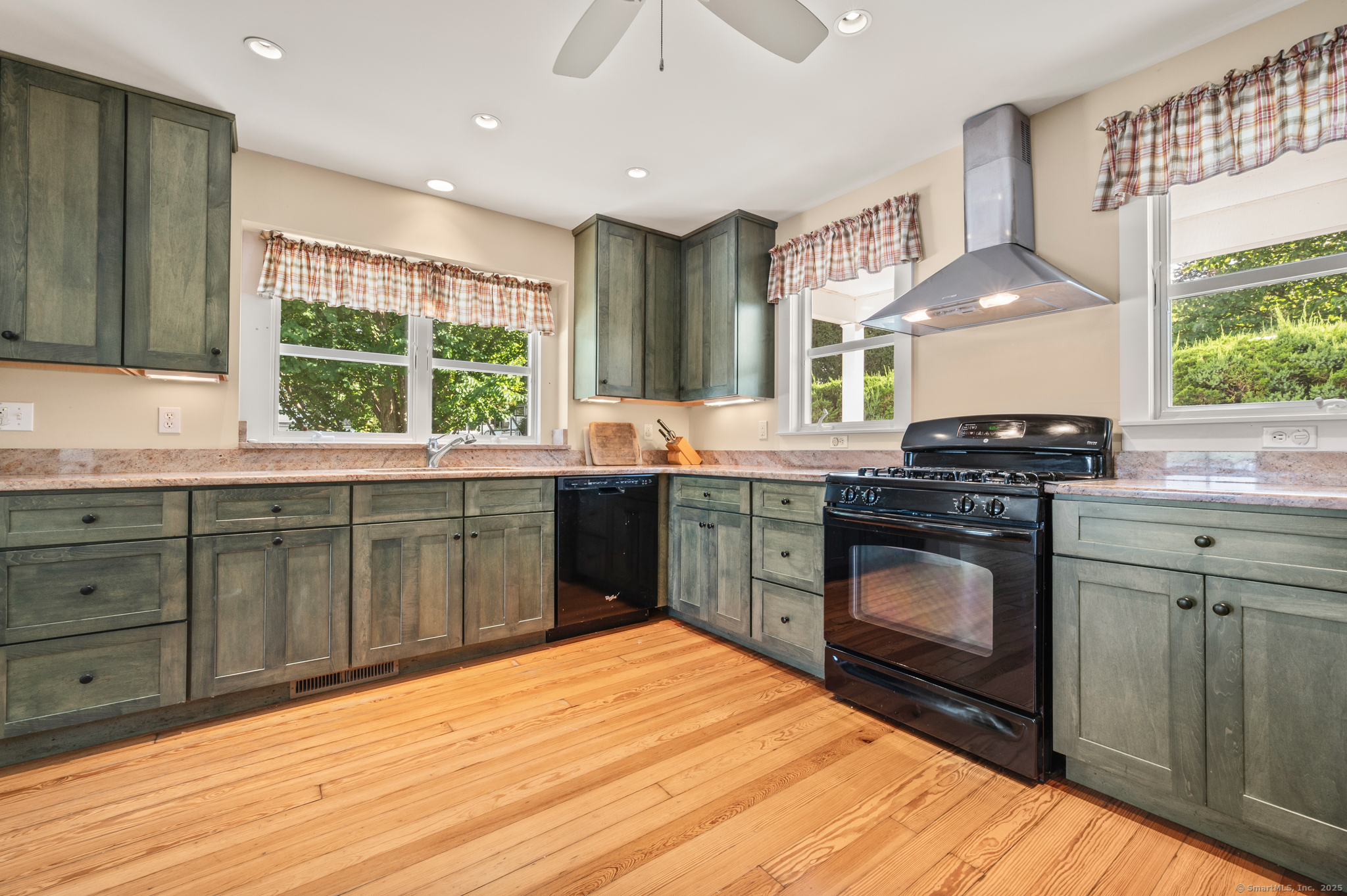 424 Bantam Lake Road Morris, CT 06763 - Photo 16 of 34 a kitchen with stainless steel appliances granite countertop a stove a sink and a microwave
