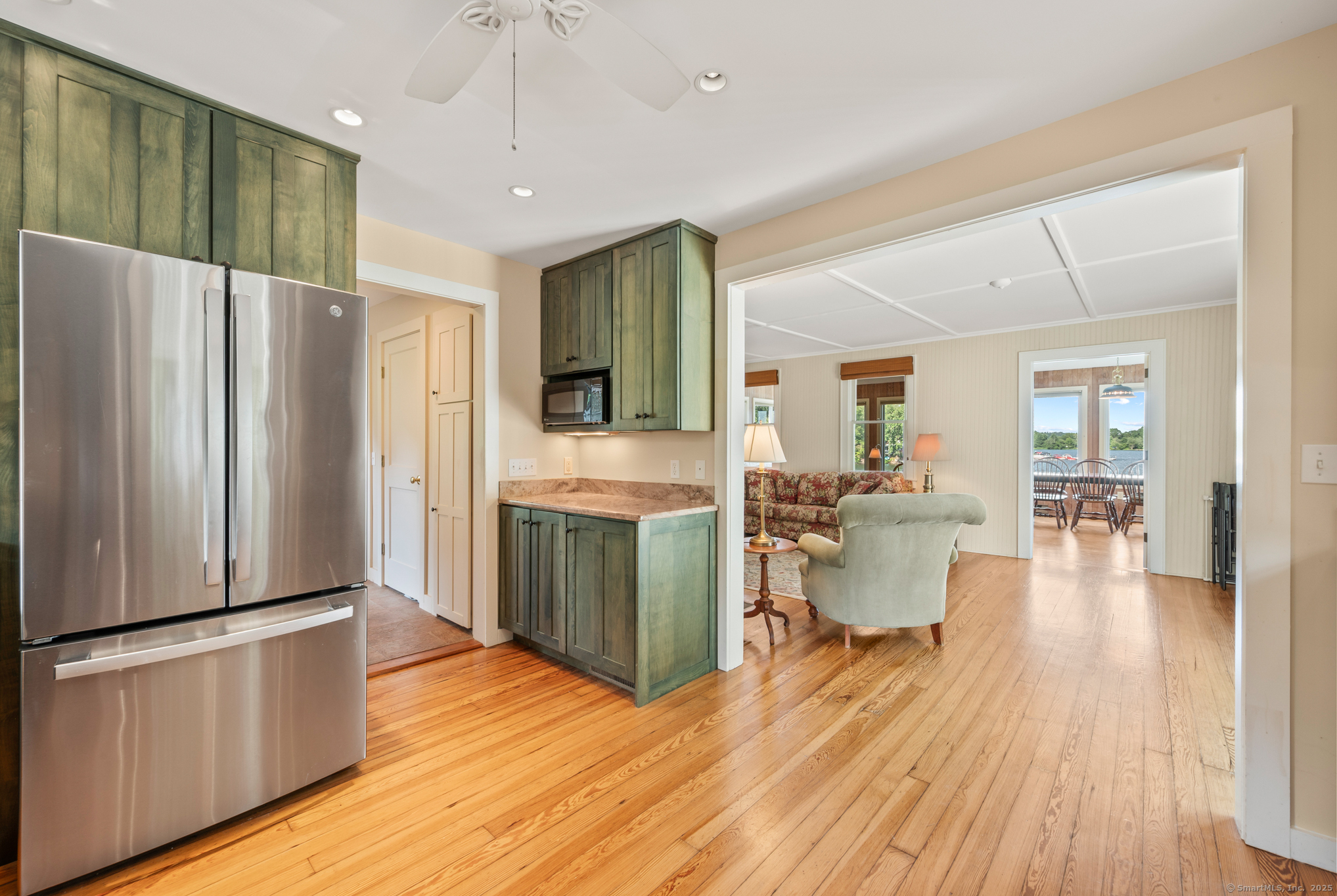 424 Bantam Lake Road Morris, CT 06763 - Photo 17 of 34 a kitchen with stainless steel appliances a refrigerator and wooden floor