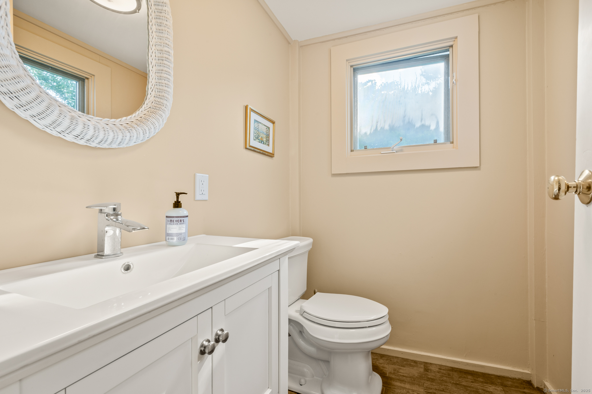 424 Bantam Lake Road Morris, CT 06763 - Photo 18 of 34 a bathroom with a sink a mirror and a toilet