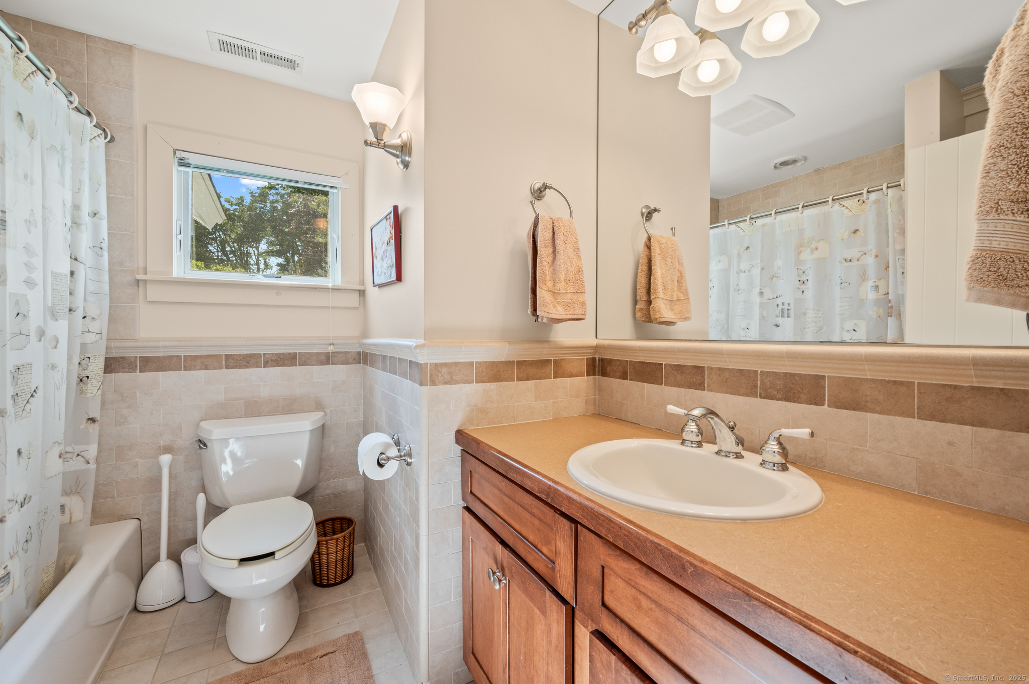 424 Bantam Lake Road Morris, CT 06763 - Photo 20 of 34 a bathroom with a sink a toilet and a mirror