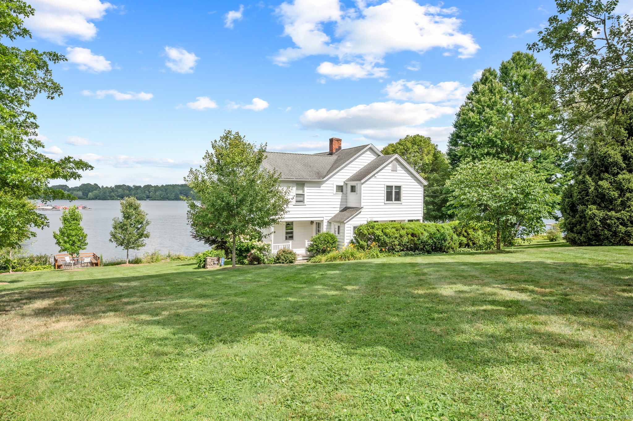 424 Bantam Lake Road Morris, CT 06763 - Photo 2 of 34 a front view of a house with a garden