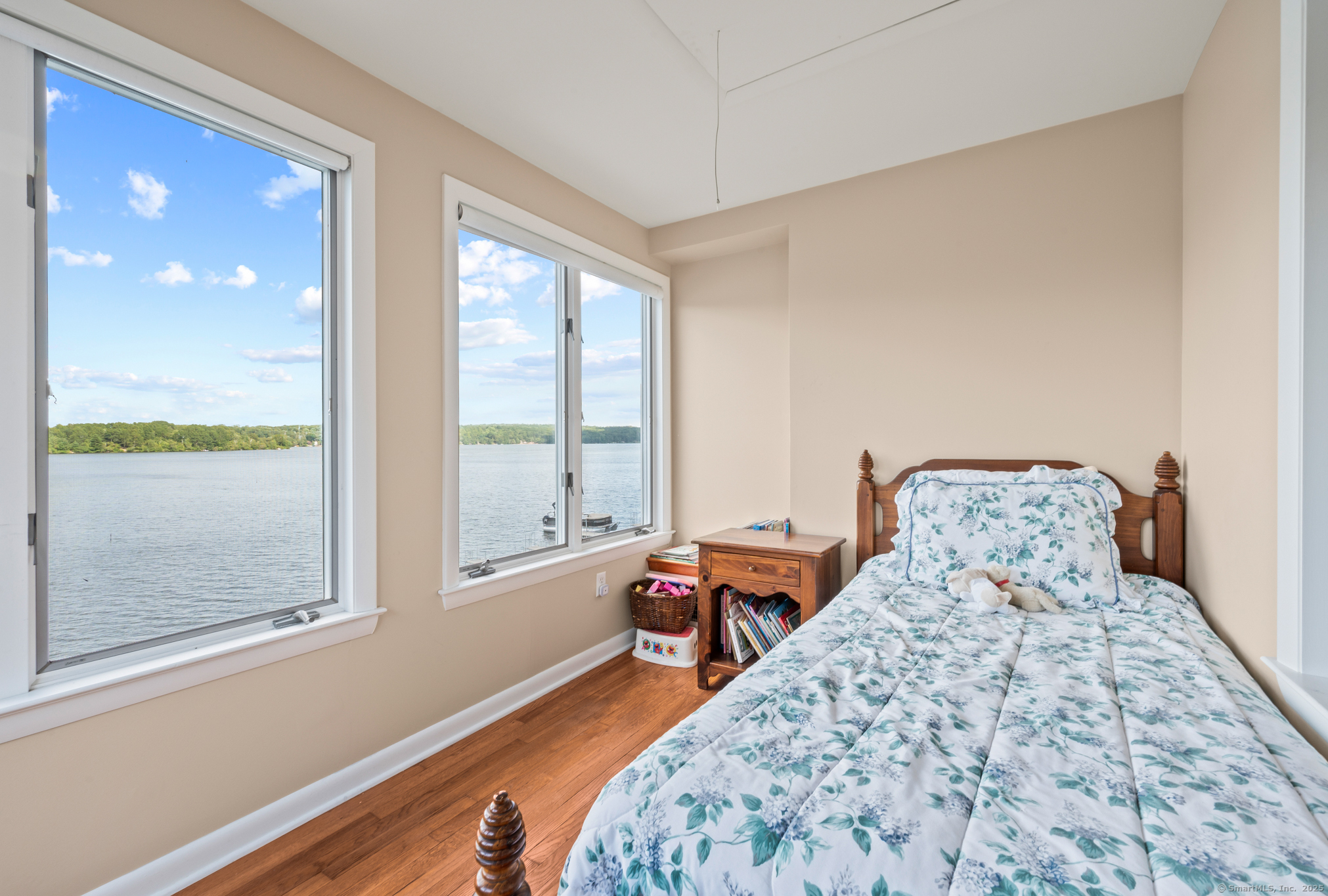 424 Bantam Lake Road Morris, CT 06763 - Photo 22 of 34 a bed sitting in a bedroom next to a window