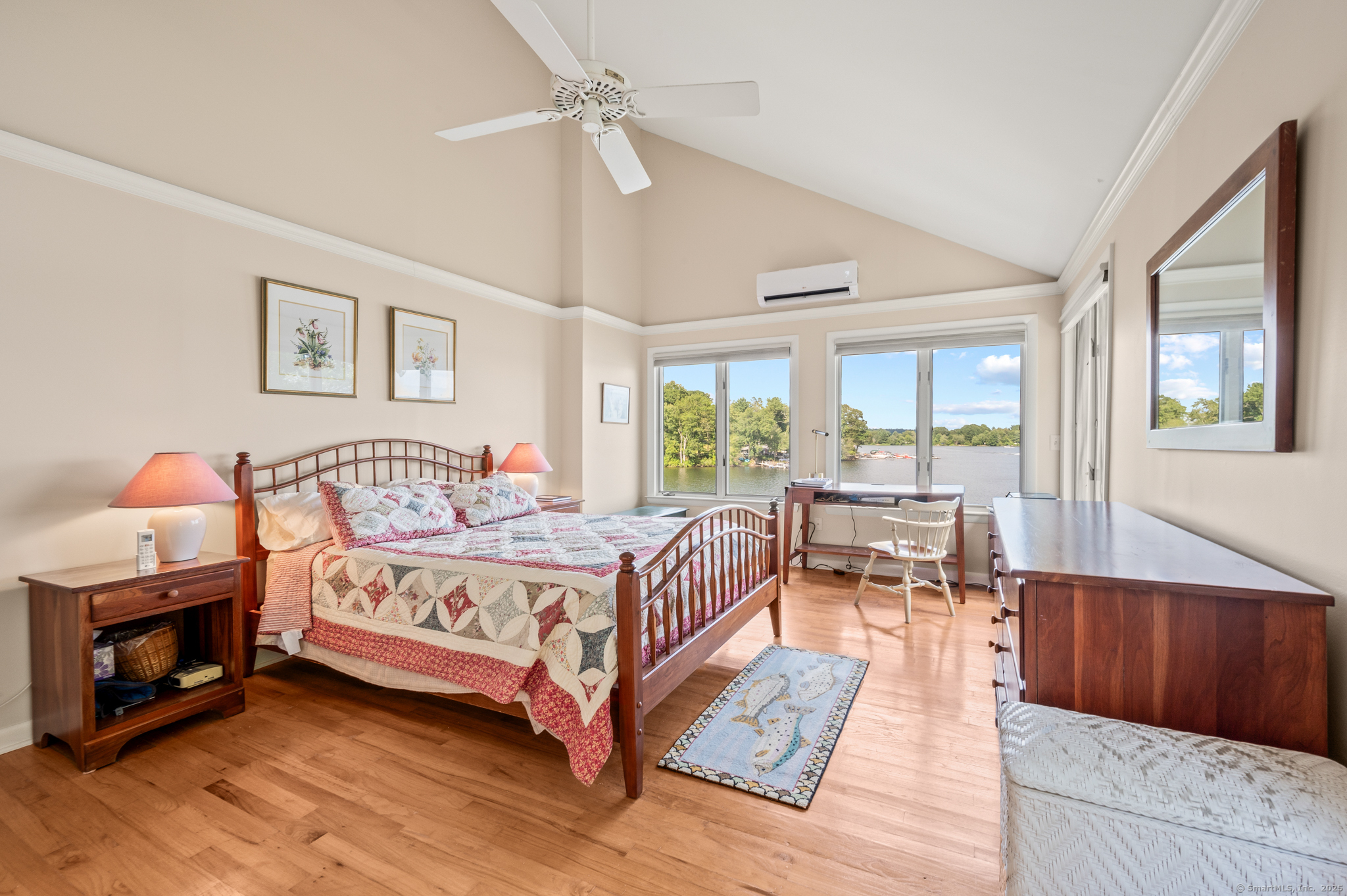 424 Bantam Lake Road Morris, CT 06763 - Photo 26 of 34 a spacious bedroom with a bed a table and large window