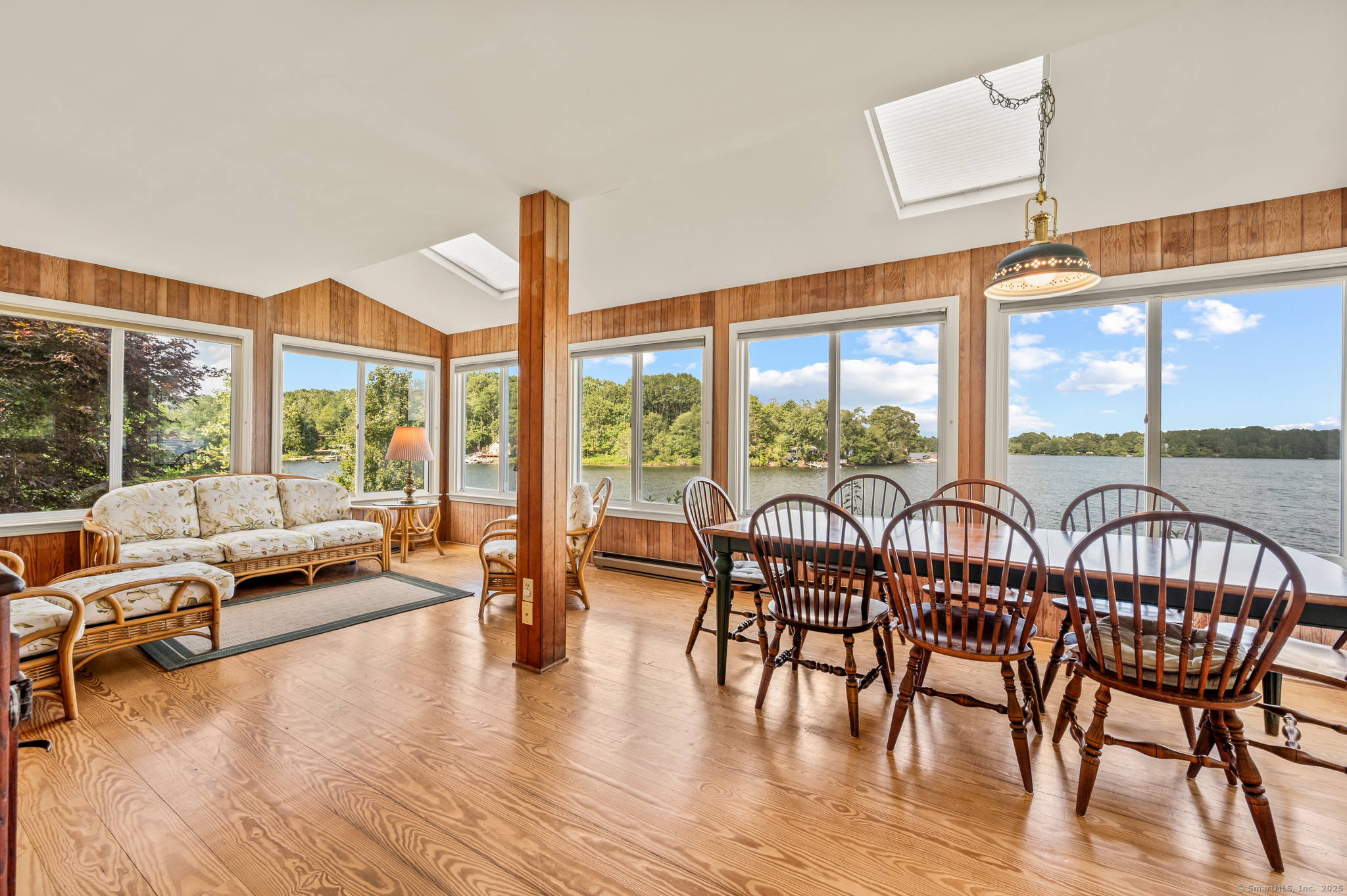 424 Bantam Lake Road Morris, CT 06763 - Photo 9 of 34 a view of a livingroom with furniture water view and large windows