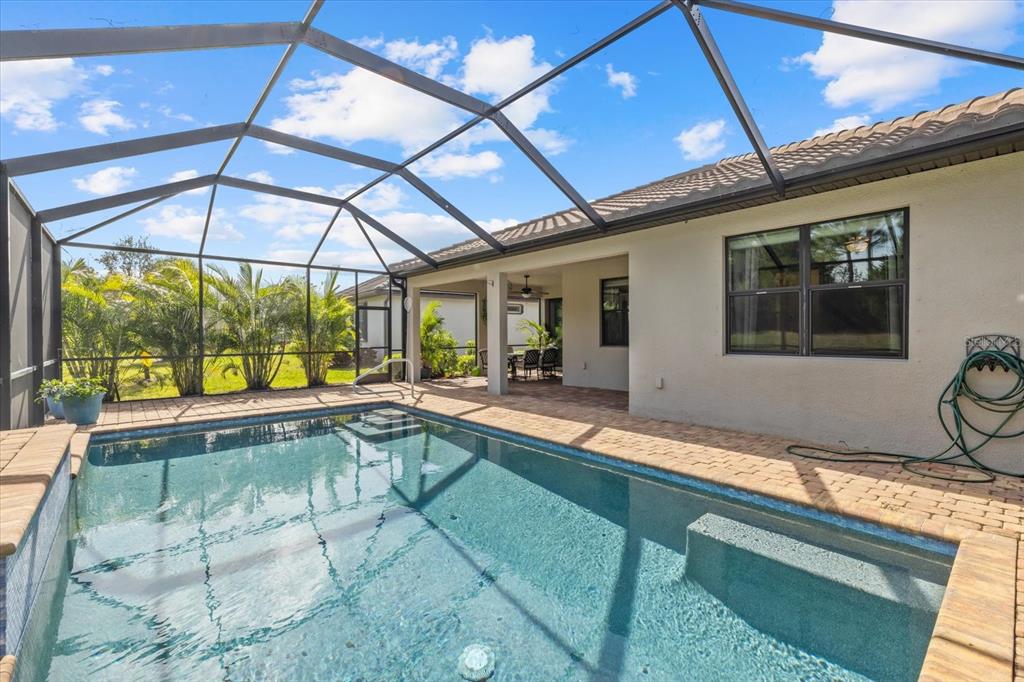 6835 Chester Trail Bradenton, FL 34202 - Photo 32 of 40 a view of a house with a swimming pool