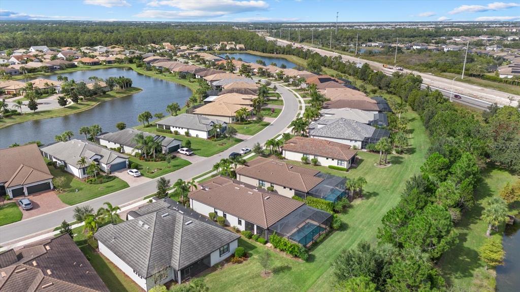6835 Chester Trail Bradenton, FL 34202 - Photo 38 of 40 an aerial view of residential houses with outdoor space and river