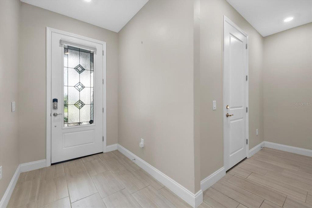 6835 Chester Trail Bradenton, FL 34202 - Photo 4 of 40 a view of an empty room and window