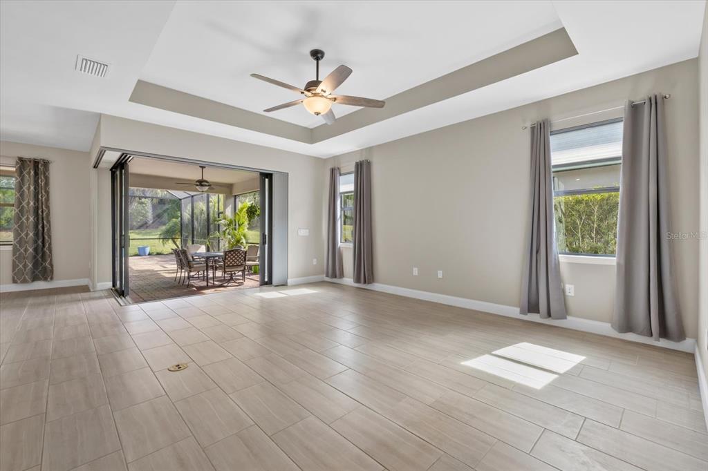 6835 Chester Trail Bradenton, FL 34202 - Photo 5 of 40 a view of an empty room with a window