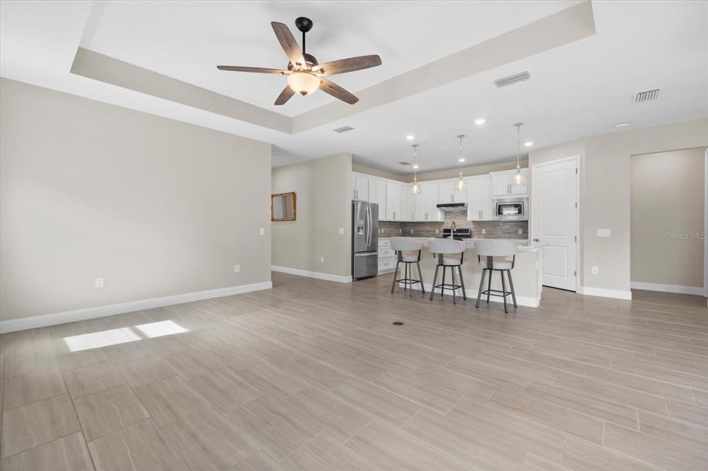 6835 Chester Trail Bradenton, FL 34202 - Photo 9 of 40 a view of kitchen with stainless steel appliances refrigerator stove microwave and cabinets