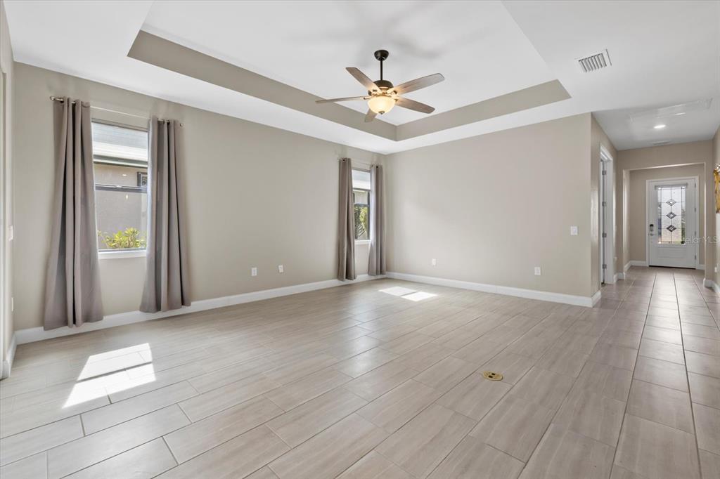 6835 Chester Trail Bradenton, FL 34202 - Photo 10 of 40 a view of a livingroom with a ceiling fan window and wooden floor