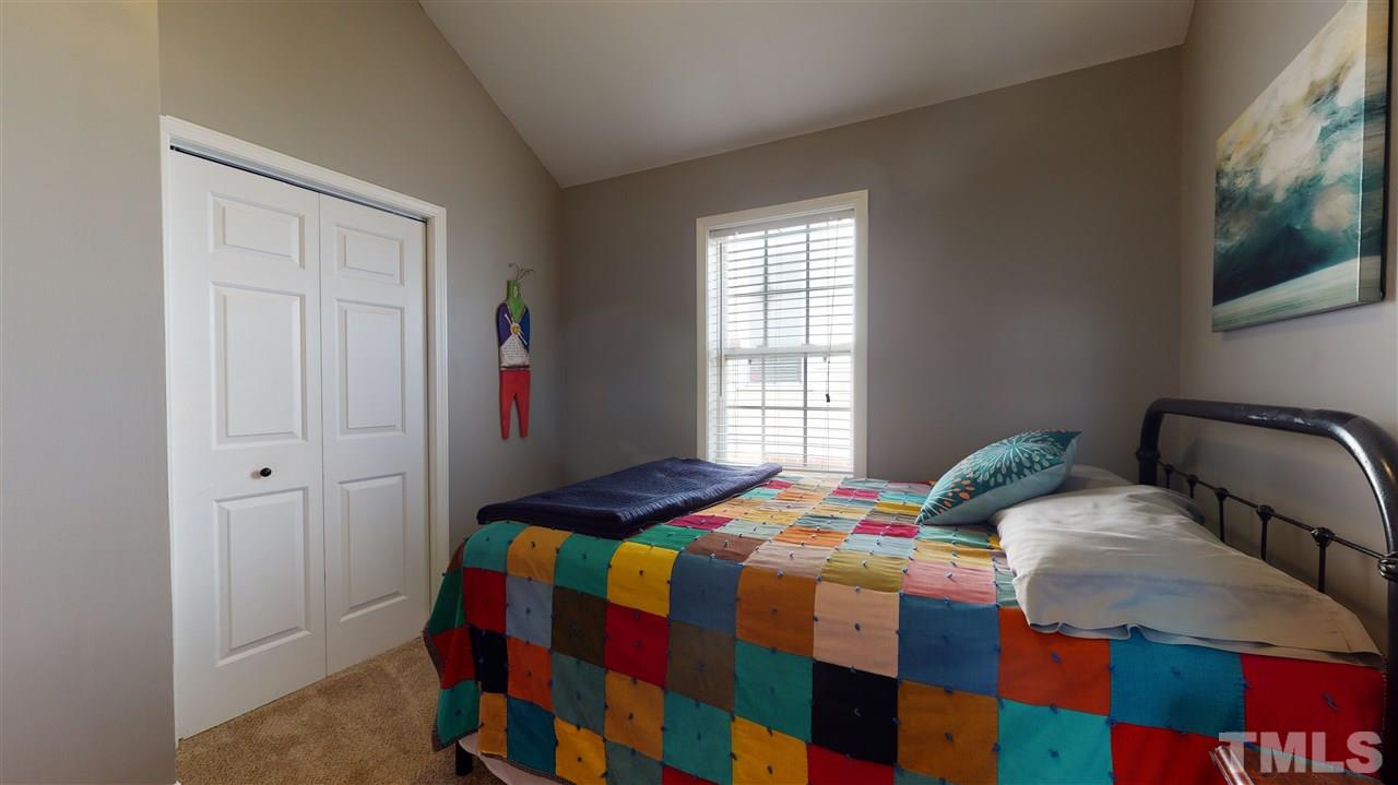 910 East Jones Street Raleigh, NC 27601 - Photo 15 of 23 a bedroom with two beds and a window