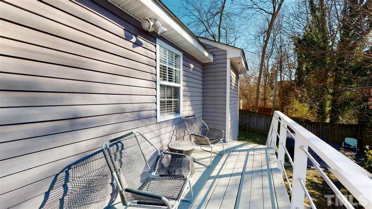 910 East Jones Street Raleigh, NC 27601 - Photo 22 of 23 a view of deck with table and chairs and wooden floor