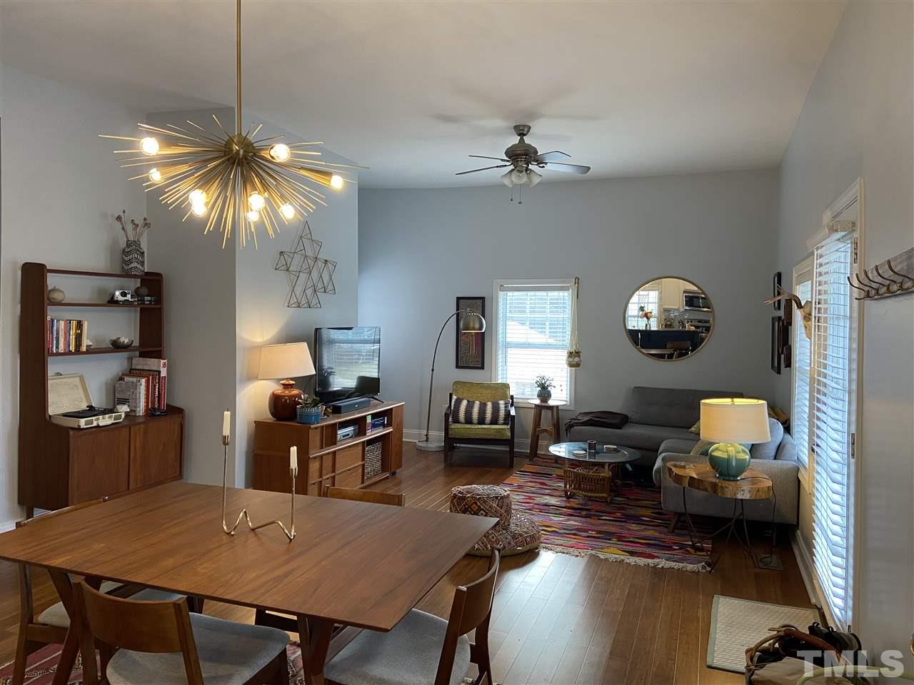 910 East Jones Street Raleigh, NC 27601 - Photo 6 of 23 a living room with furniture and a chandelier