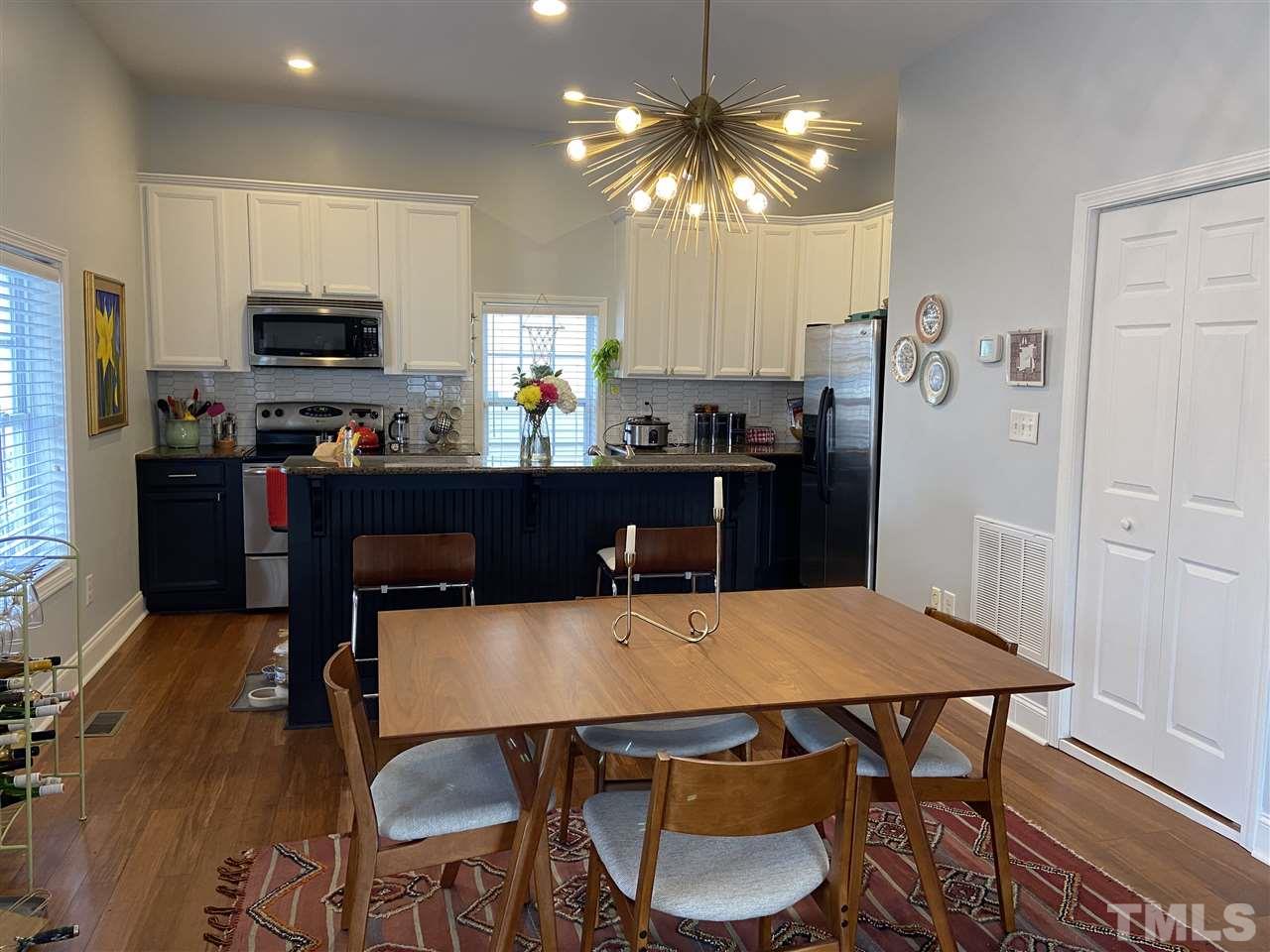 910 East Jones Street Raleigh, NC 27601 - Photo 7 of 23 a view of a dining room with furniture