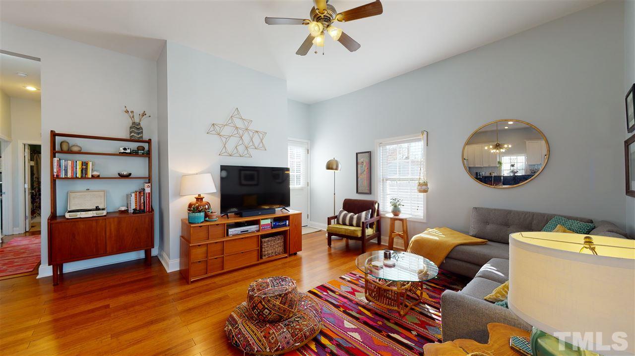 910 East Jones Street Raleigh, NC 27601 - Photo 9 of 23 a living room with furniture and a flat screen tv