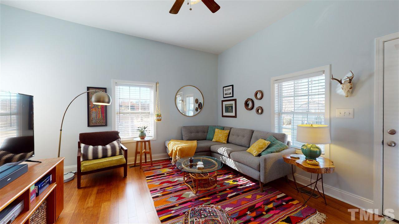 910 East Jones Street Raleigh, NC 27601 - Photo 10 of 23 a living room with furniture and wooden floor
