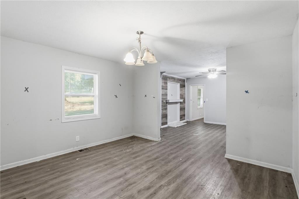 192 Highway 138 Stockbridge, GA 30281 - Photo 11 of 23 an empty room with wooden floor and windows