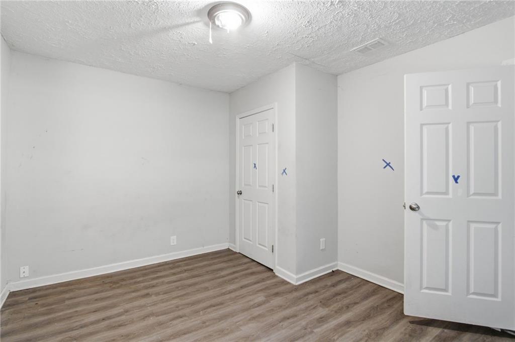 192 Highway 138 Stockbridge, GA 30281 - Photo 13 of 23 a view of an empty room with wooden floor