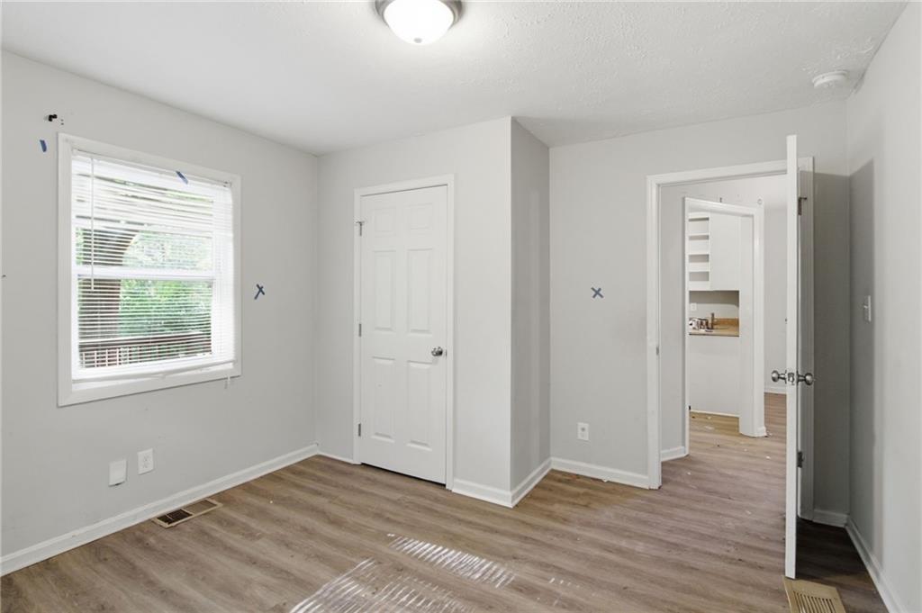 192 Highway 138 Stockbridge, GA 30281 - Photo 15 of 23 a view of an empty room with wooden floor and a window