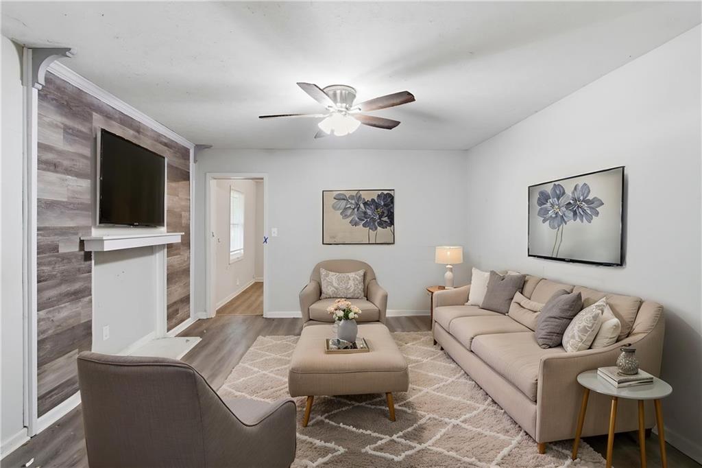 192 Highway 138 Stockbridge, GA 30281 - Photo 2 of 23 a living room with furniture and a flat screen tv