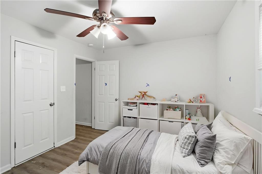 192 Highway 138 Stockbridge, GA 30281 - Photo 5 of 23 a bedroom with a bed and a chandelier