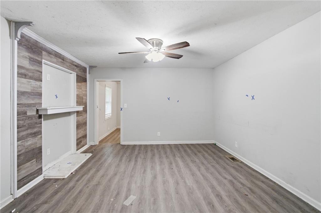 192 Highway 138 Stockbridge, GA 30281 - Photo 8 of 23 wooden floor in an empty room with a window