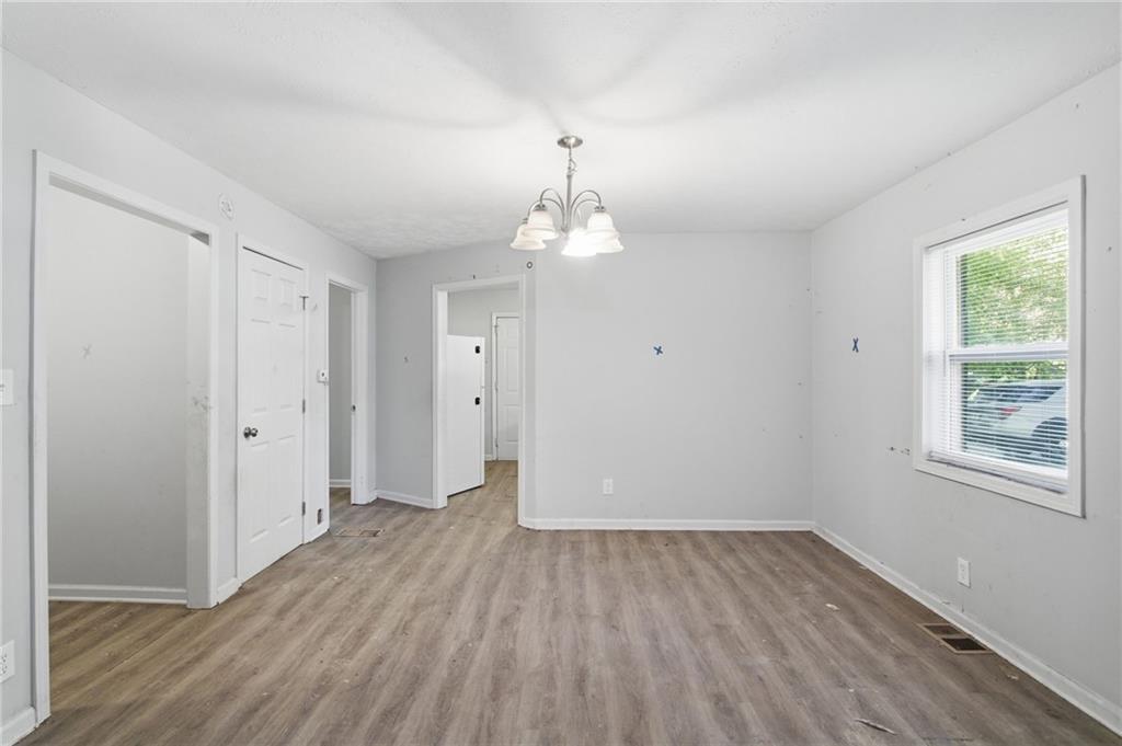 192 Highway 138 Stockbridge, GA 30281 - Photo 10 of 23 wooden floor in an empty room with a window