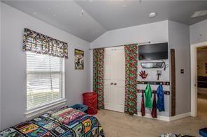 1409 Rosson Road Little Elm, TX 75068 - Photo 15 of 34 Vaulted ceiling room with an exterior window featuring blinds and a patterned valance