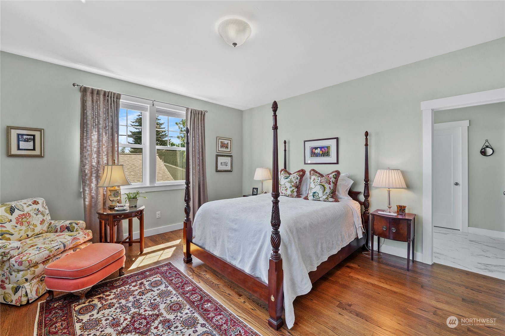 1505 9th Street Anacortes, WA 98221 - Photo 12 of 40 a bedroom with a bed and wooden floor