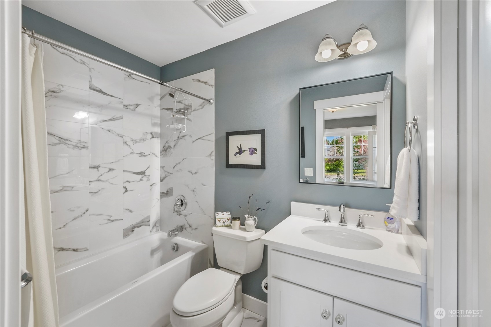 1505 9th Street Anacortes, WA 98221 - Photo 24 of 40 a bathroom with a sink toilet and shower