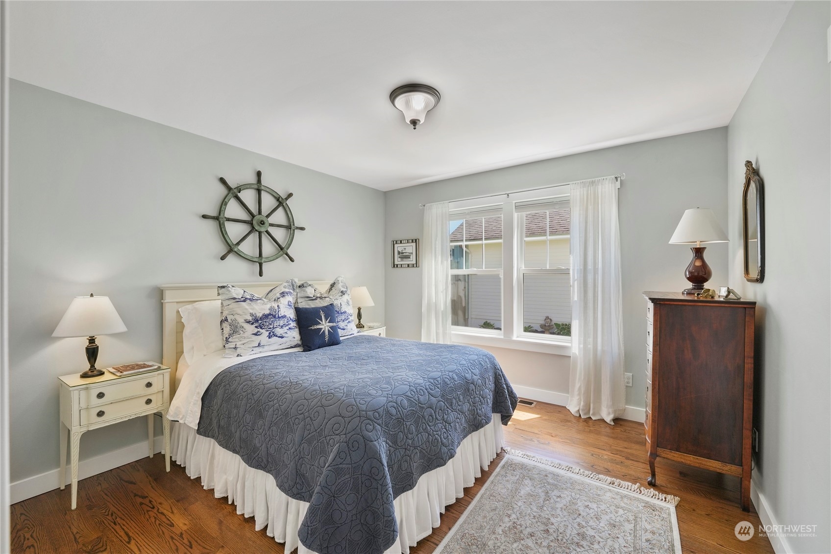 1505 9th Street Anacortes, WA 98221 - Photo 26 of 40 a bedroom with a large bed and a window