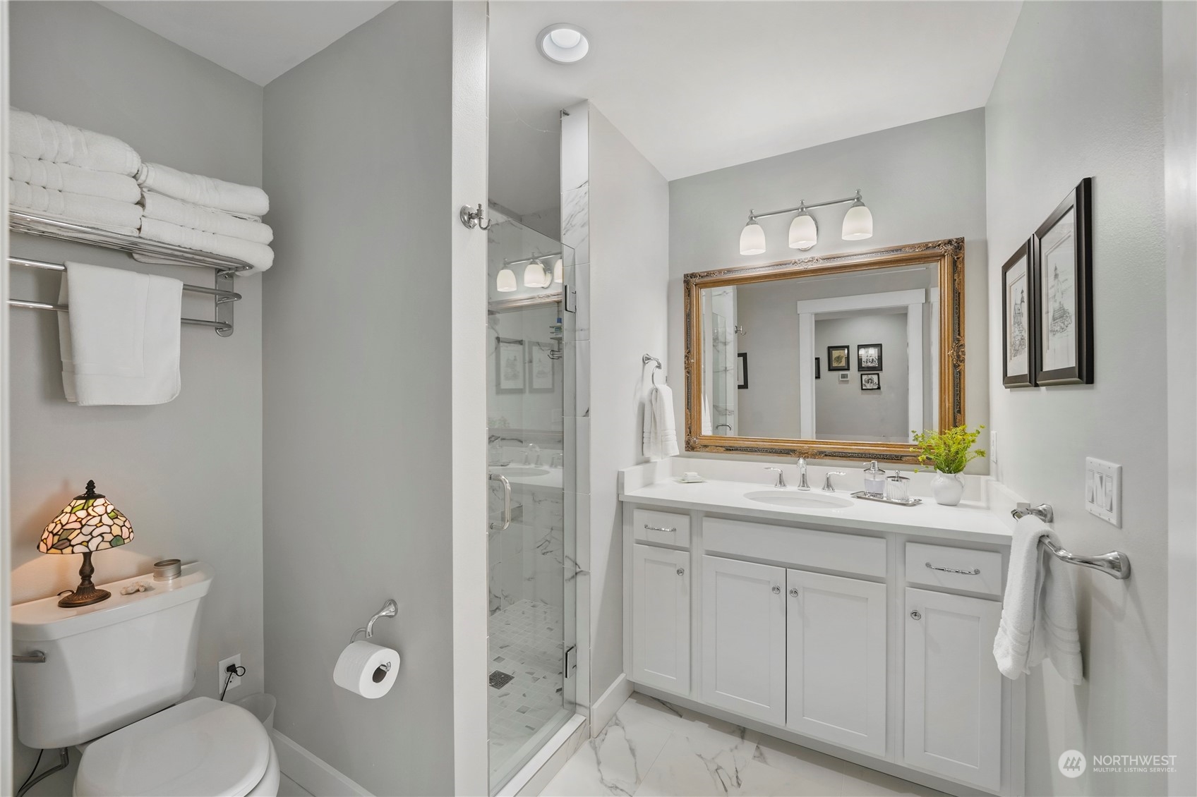 1505 9th Street Anacortes, WA 98221 - Photo 27 of 40 a bathroom with a toilet sink and mirror
