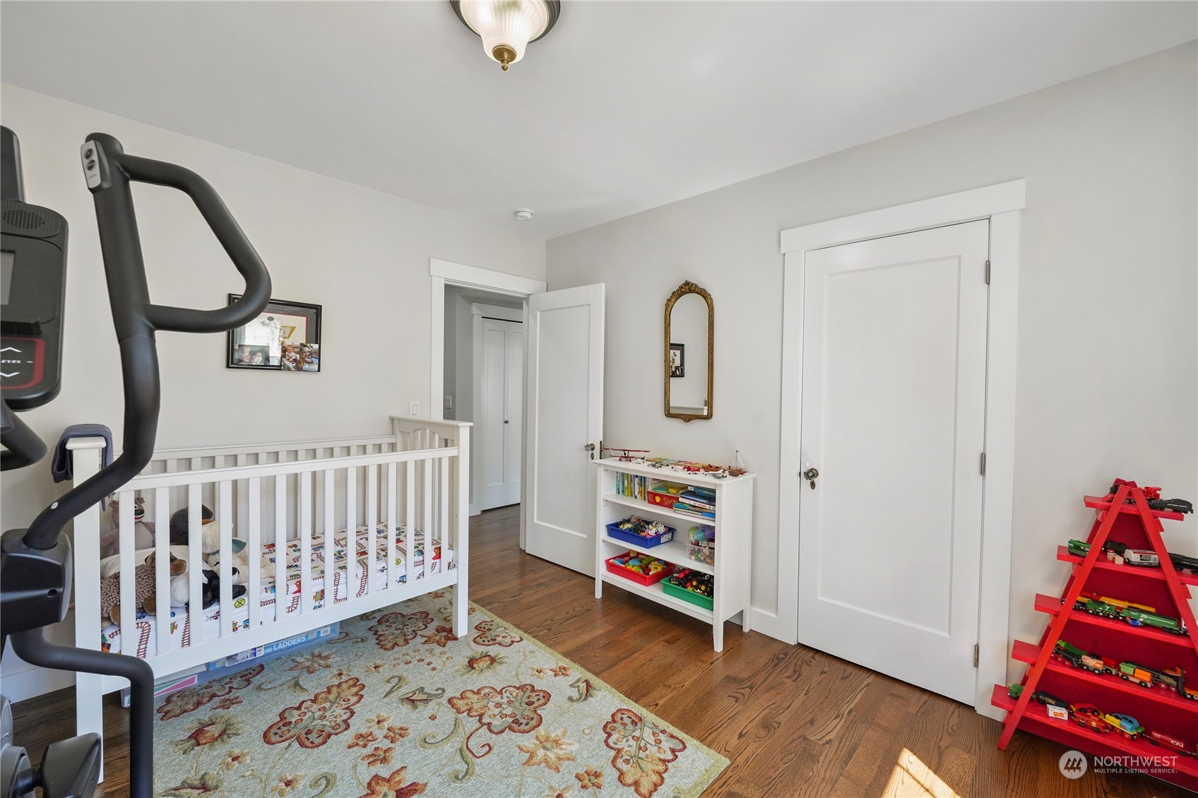 1505 9th Street Anacortes, WA 98221 - Photo 28 of 40 a bedroom with furniture and wooden floor