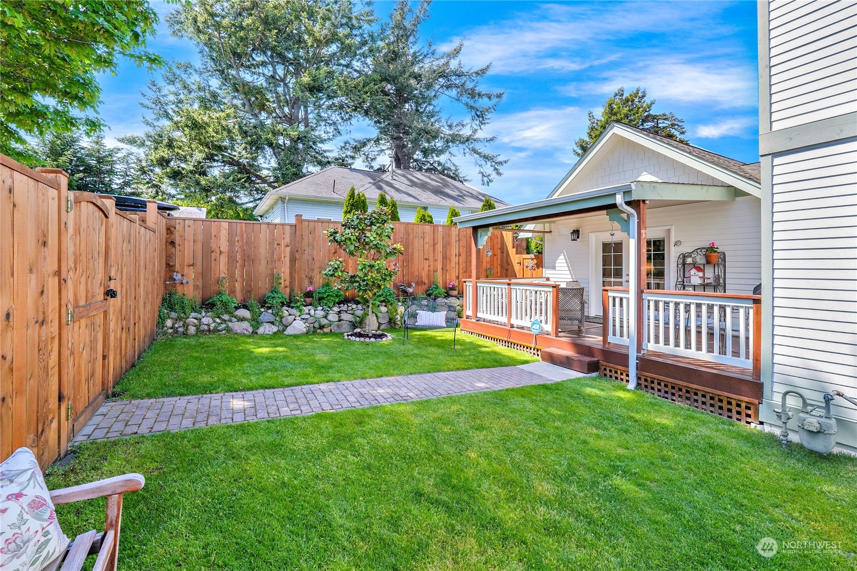 1505 9th Street Anacortes, WA 98221 - Photo 30 of 40 a view of an house with backyard and a garden