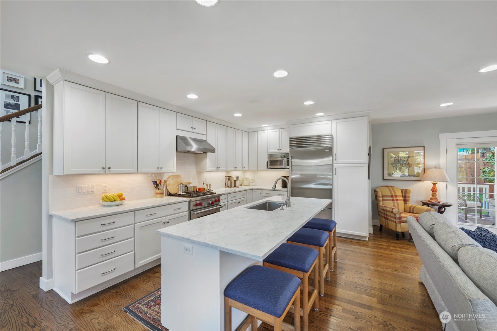 1505 9th Street Anacortes, WA 98221 - Photo 10 of 40 a kitchen with white cabinets and stainless steel appliances