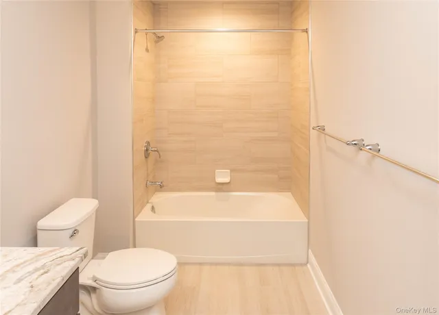 a bathroom with a shower and a bathtub