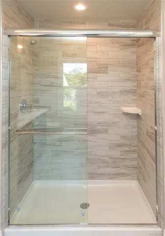 a bathroom with a sink vanity mirror and toilet