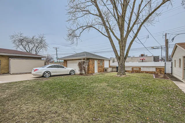 a white house in middle of the forest