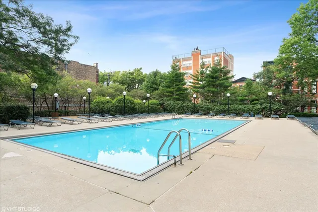 a view of swimming pool with a yard