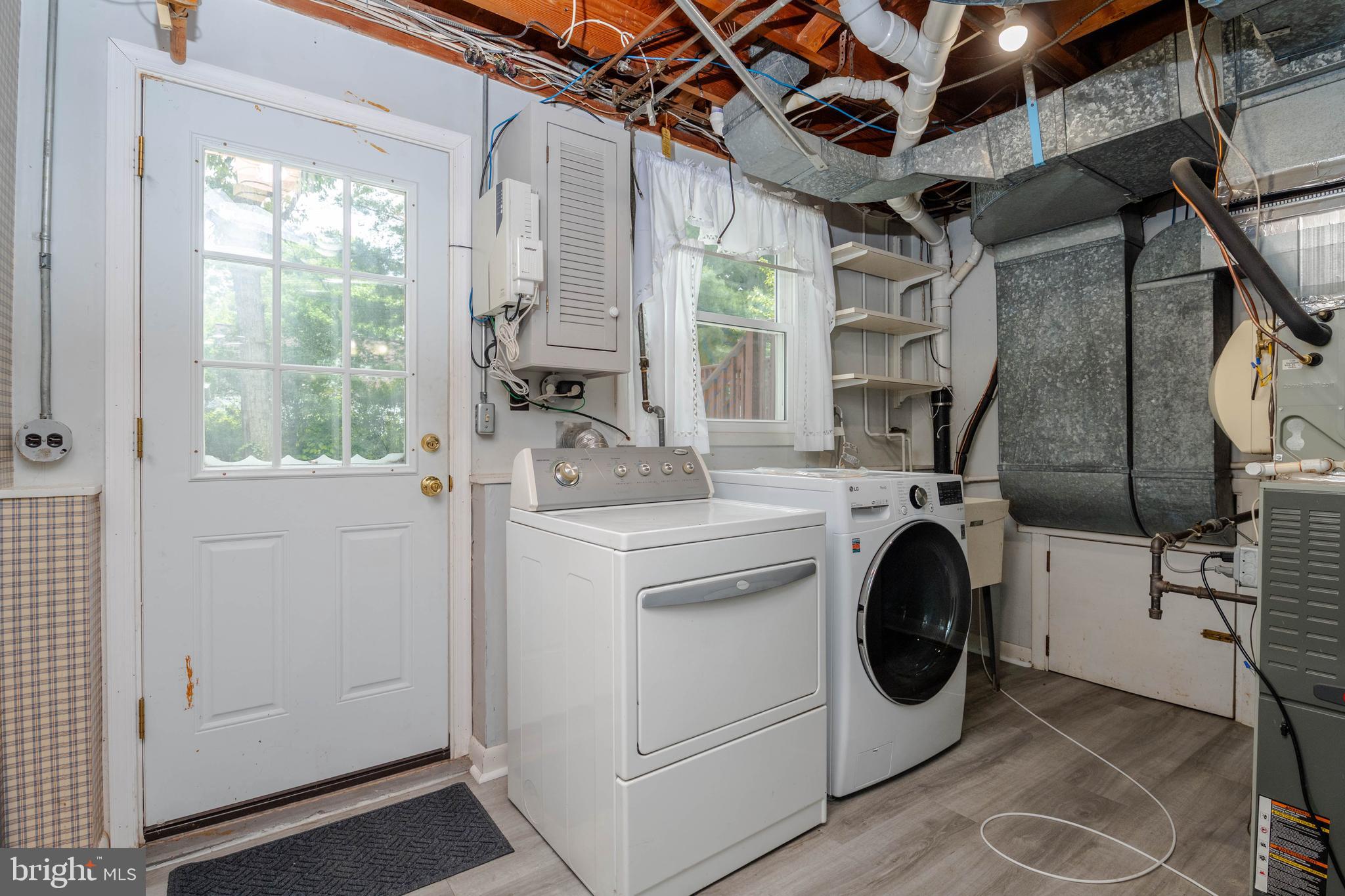 1823 Dunwoody Road Baltimore, MD 21234 - Photo 23 of 32 LAUNDRY ROOM WITH ACCESS TO PATIO & YARD