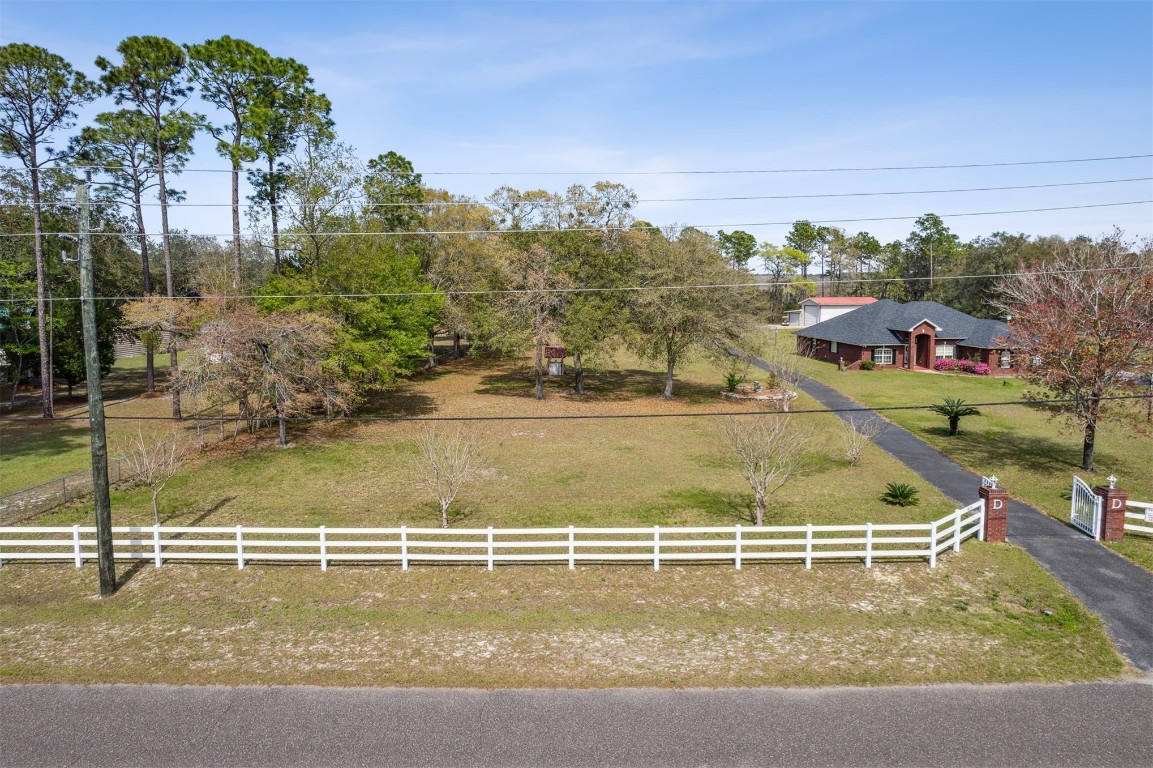 85166 Blackmon Road Yulee, FL 32097 - Photo 2 of 26 a view of a swimming pool with a yard