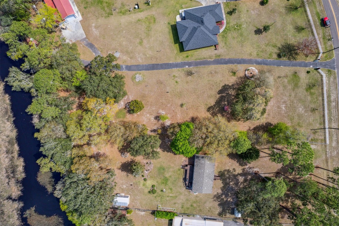 85166 Blackmon Road Yulee, FL 32097 - Photo 4 of 26 an aerial view of a house with a yard