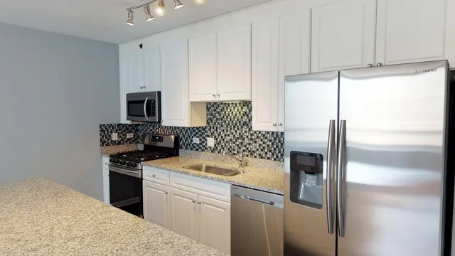 a hallway with washer and dryer