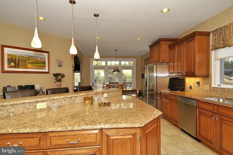 6312 Walhonding Road Bethesda, MD 20816 - Photo 2 of 29 Kitchen island looking towards breakfast room