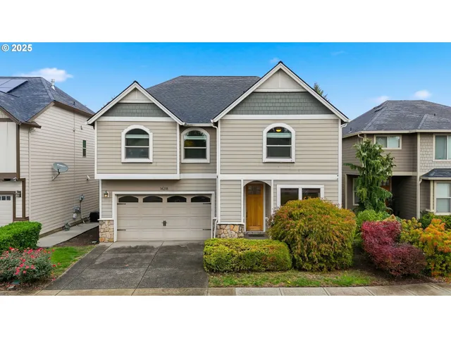 an aerial view of a house with a swimming pool yard and outdoor seating