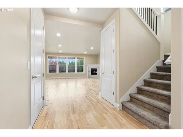 a view of an entryway with wooden floor