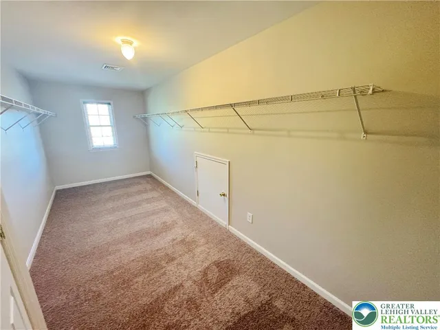 a view of a room with racks on the wall