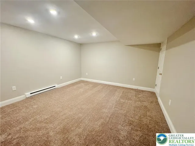 a bathroom with a sink toilet and a mirror