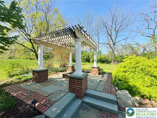 a view of yard with swimming pool and outdoor seating