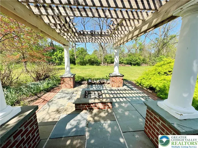 a view of a backyard with sitting area